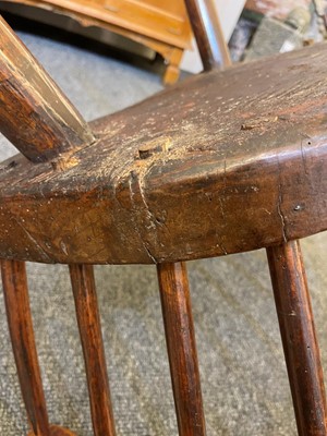 Lot 356 - A large ash and elm comb-back Windsor armchair