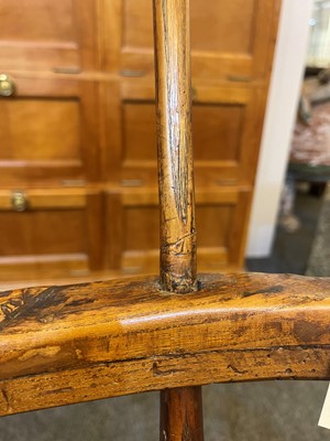 Lot 356 - A large ash and elm comb-back Windsor armchair