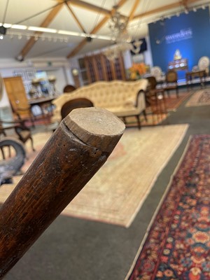 Lot 356 - A large ash and elm comb-back Windsor armchair
