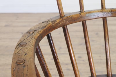 Lot 356 - A large ash and elm comb-back Windsor armchair