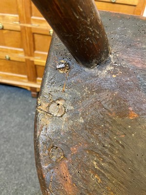 Lot 356 - A large ash and elm comb-back Windsor armchair
