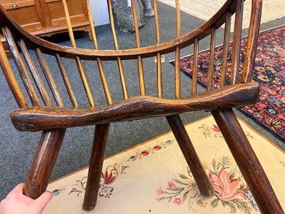 Lot 356 - A large ash and elm comb-back Windsor armchair
