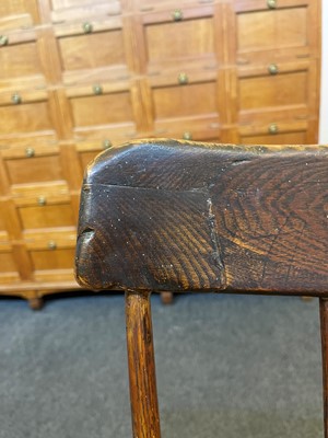 Lot 356 - A large ash and elm comb-back Windsor armchair