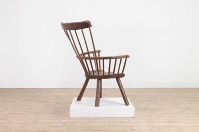 Lot 356 - A large ash and elm comb-back Windsor armchair