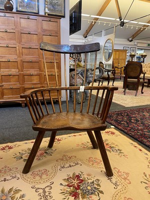 Lot 356 - A large ash and elm comb-back Windsor armchair