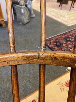 Lot 356 - A large ash and elm comb-back Windsor armchair