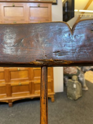 Lot 356 - A large ash and elm comb-back Windsor armchair