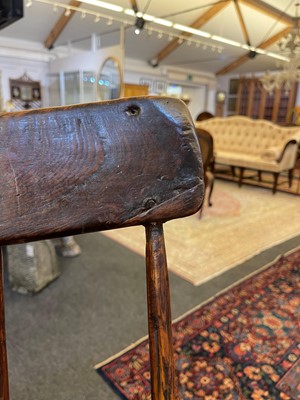 Lot 356 - A large ash and elm comb-back Windsor armchair