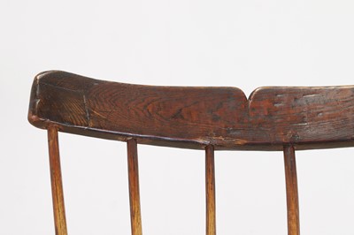 Lot 356 - A large ash and elm comb-back Windsor armchair
