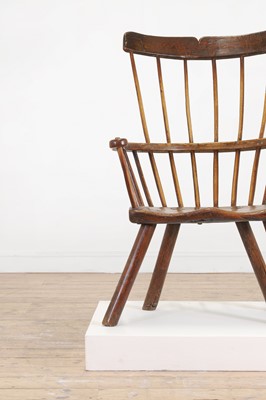 Lot 356 - A large ash and elm comb-back Windsor armchair