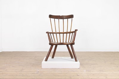 Lot 356 - A large ash and elm comb-back Windsor armchair