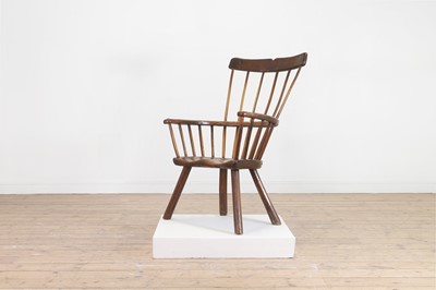 Lot 356 - A large ash and elm comb-back Windsor armchair