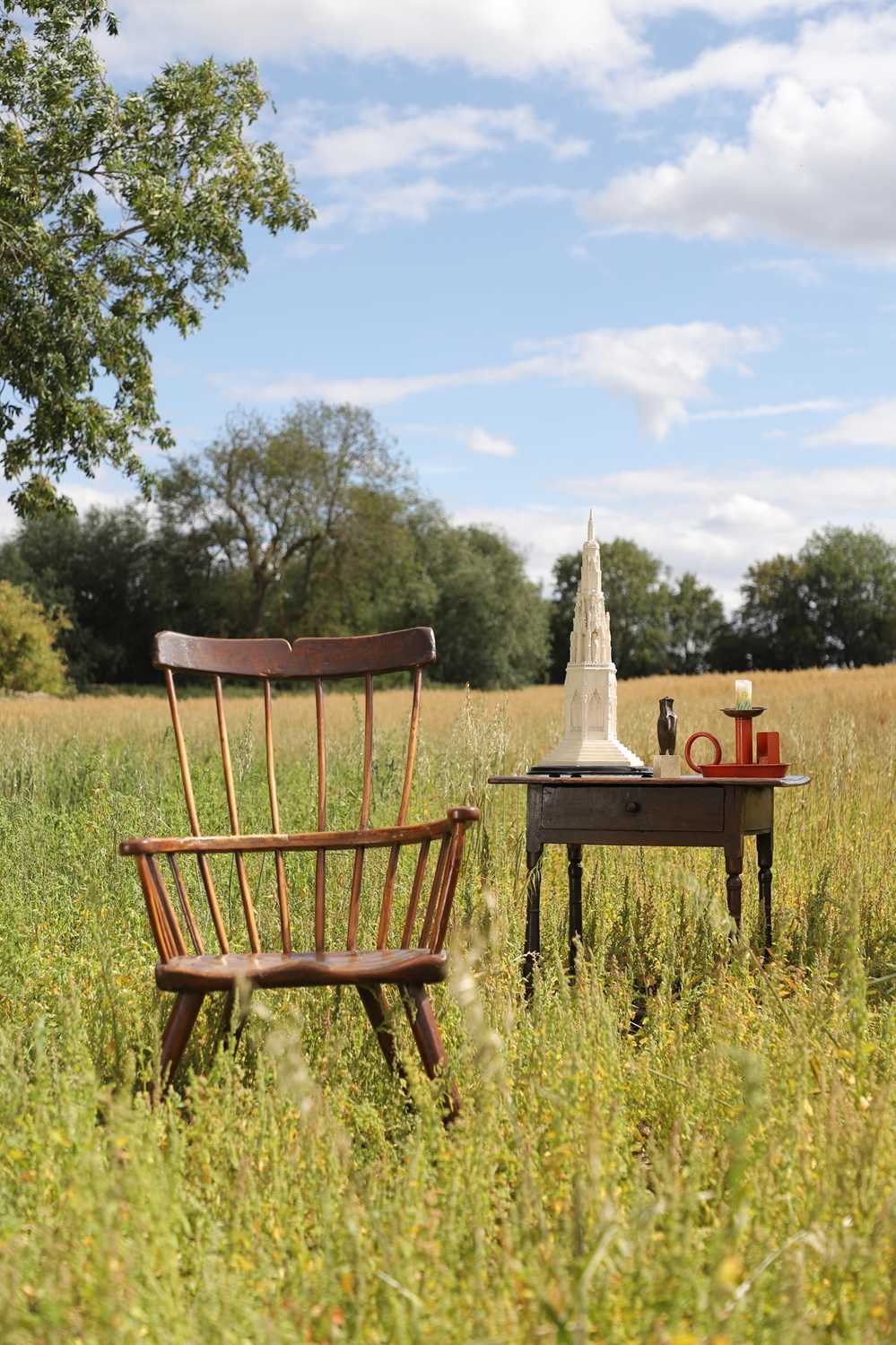 Lot 356 - A large ash and elm comb-back Windsor armchair
