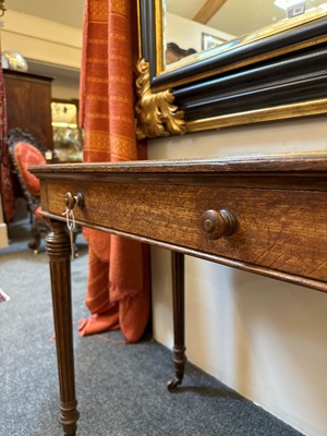 Lot 404 - An oak writing table by Holland & Sons
