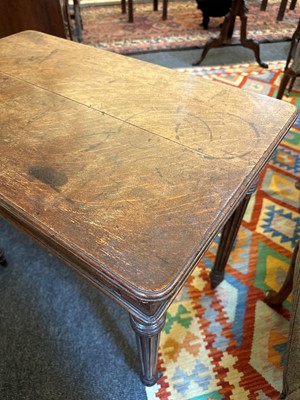 Lot 404 - An oak writing table by Holland & Sons