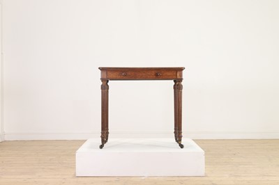 Lot 404 - An oak writing table by Holland & Sons