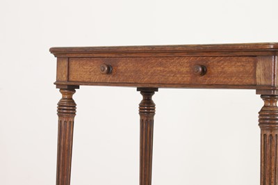 Lot 404 - An oak writing table by Holland & Sons