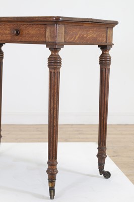 Lot 404 - An oak writing table by Holland & Sons