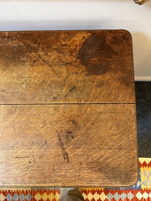 Lot 404 - An oak writing table by Holland & Sons