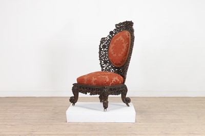 Lot 236 - A carved teak low chair