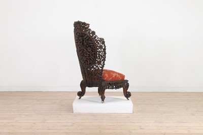 Lot 236 - A carved teak low chair