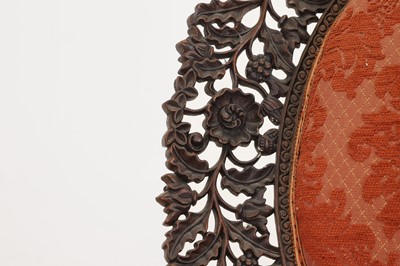 Lot 236 - A carved teak low chair