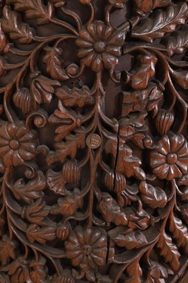 Lot 236 - A carved teak low chair