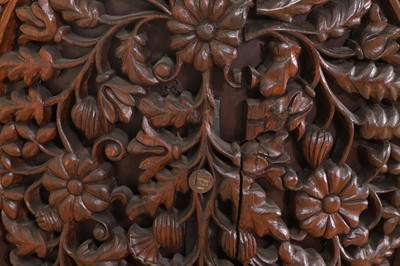 Lot 236 - A carved teak low chair