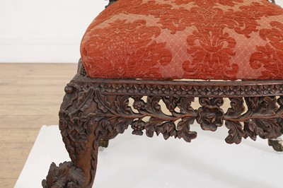 Lot 236 - A carved teak low chair