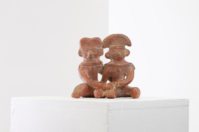Lot 82 - A clay figure group