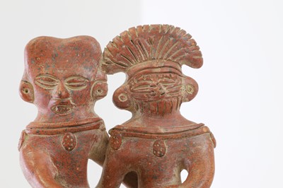 Lot 82 - A clay figure group