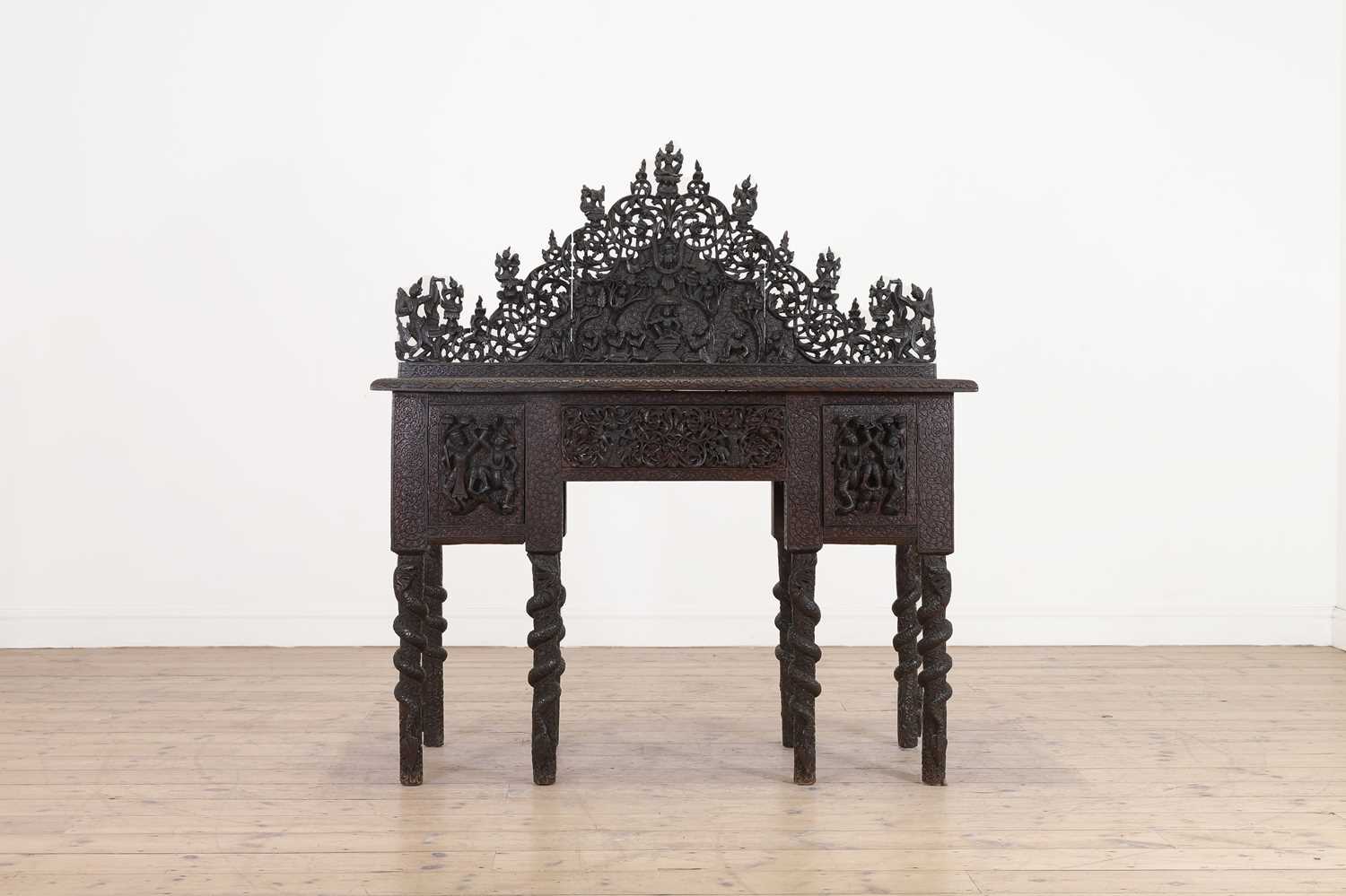 Lot 234 - A carved teak serving table