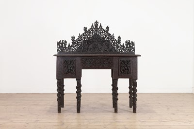 Lot 234 - A carved teak serving table