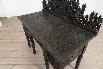 Lot 234 - A carved teak serving table