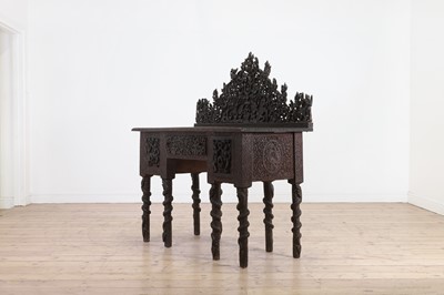 Lot 234 - A carved teak serving table