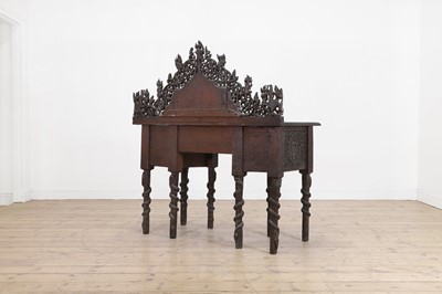 Lot 234 - A carved teak serving table