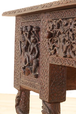 Lot 234 - A carved teak serving table