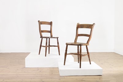 Lot 464 - A harlequin set of fourteen elm and beech kitchen chairs