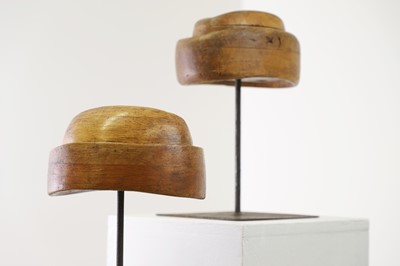 Lot 503 - Two fruitwood milliner's stands or hat moulds