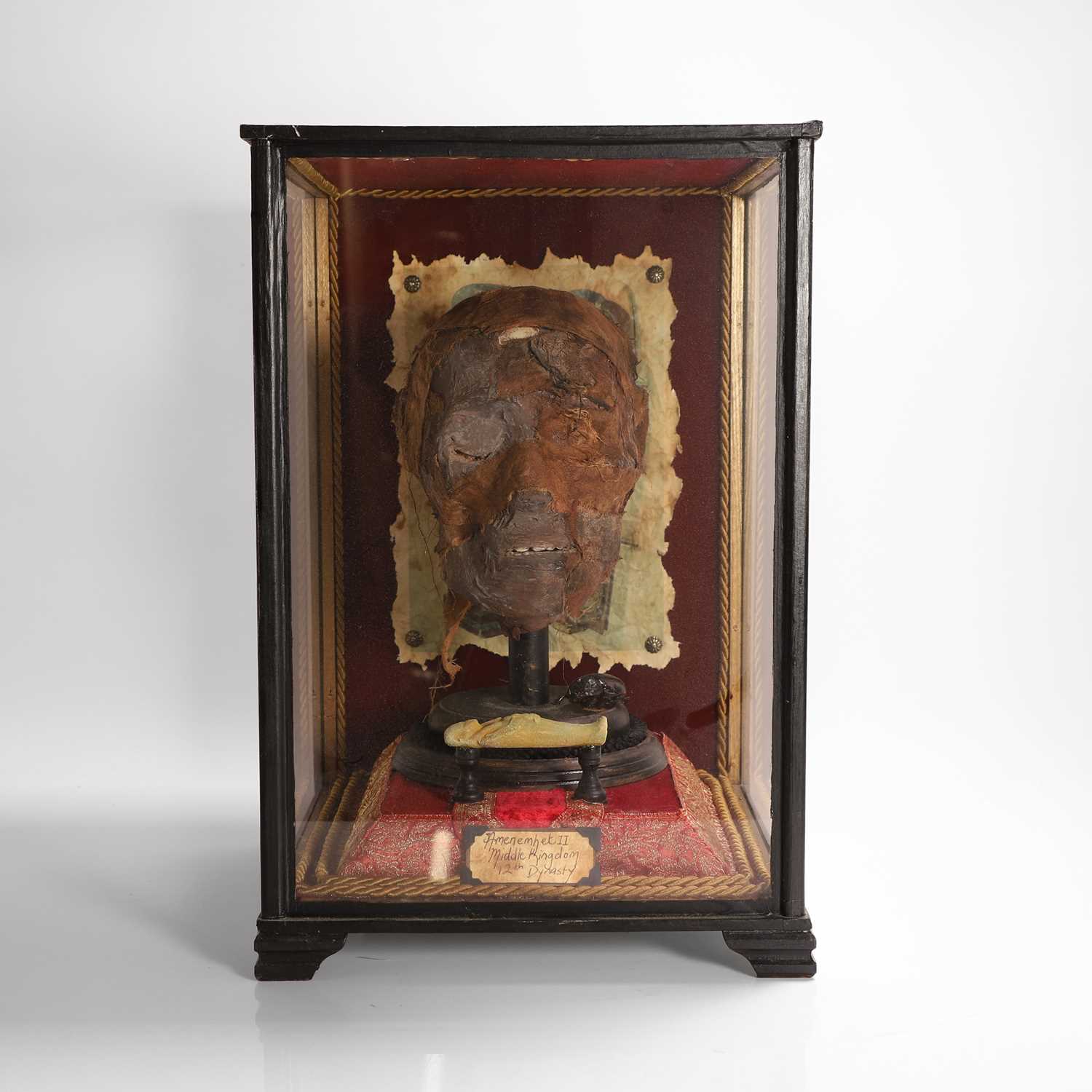 Lot 58 - A replica Egyptian mummy's head