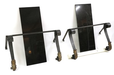 Lot 417 - A pair of wrought iron and granite topped console tables