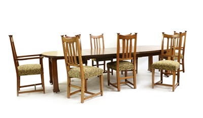 Lot 412 - An Arts & Crafts oak wind-out dining table