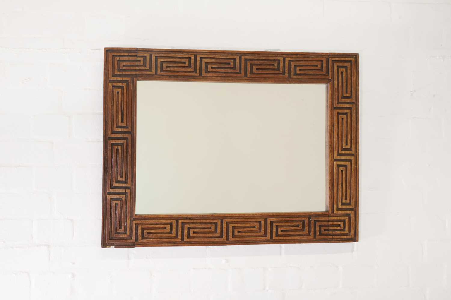 Lot 170 - A carved wooden mirror