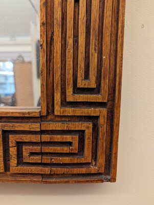 Lot 170 - A carved wooden mirror
