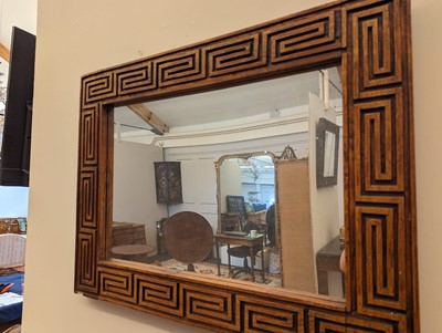 Lot 170 - A carved wooden mirror