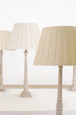 Lot 493 - A set of six limed wooden table lamps by OKA