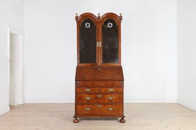 Lot 80 - A Queen Anne walnut and parcel-gilt bureau bookcase