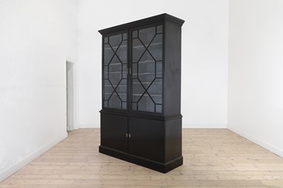 Lot 88 - A George III-style ebonised mahogany bookcase
