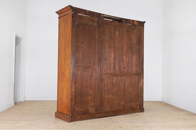 Lot 400 - A late Victorian pitch pine wardrobe by Howard & Sons