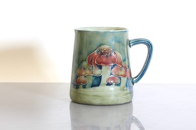 Lot 68 - A Liberty & Co. Moorcroft 'Claremont' pottery christening mug